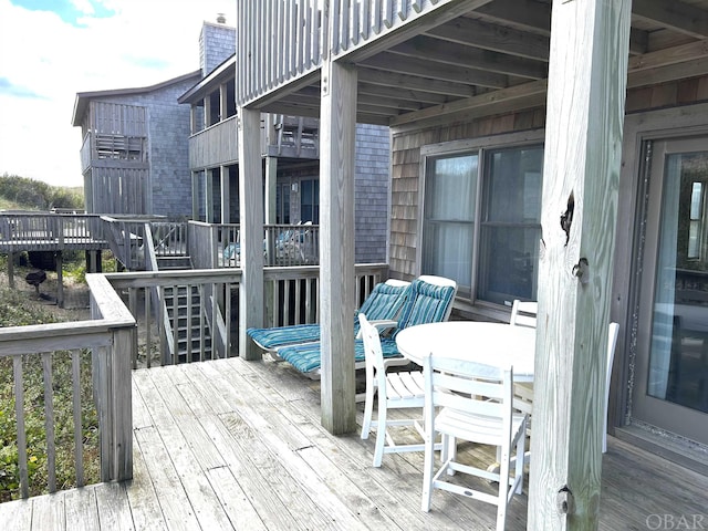 deck featuring outdoor dining area