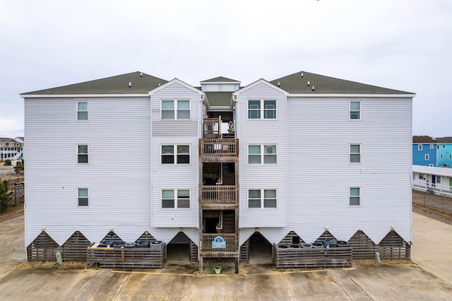 view of property featuring uncovered parking