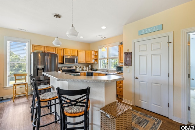 1800 Saint David Rd Unit 104-D 2, Kill Devil Hills, NC 27948 - kitchen featuring stainless steel appliances, dark wood-style flooring, a center island, pendant lighting, and open shelves