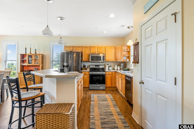 1800 Saint David Rd Unit 104-D 2, Kill Devil Hills, NC 27948 - kitchen featuring stainless steel appliances, dark wood-type flooring, hanging light fixtures, a kitchen island, and open shelves