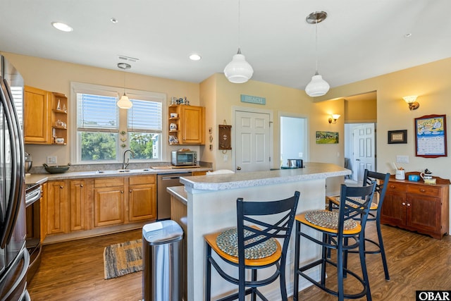 1800 Saint David Rd Unit 104-D 2, Kill Devil Hills, NC 27948 - kitchen featuring stainless steel appliances, open shelves, dark wood finished floors, light countertops, and recessed lighting