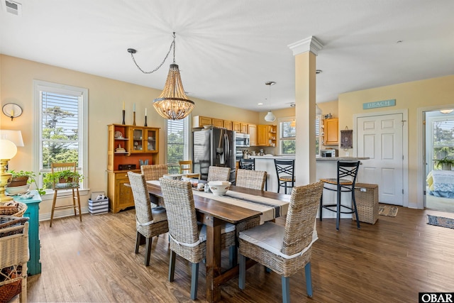 1800 Saint David Rd Unit 104-D 2, Kill Devil Hills, NC 27948 - dining area featuring light wood-style flooring and a chandelier