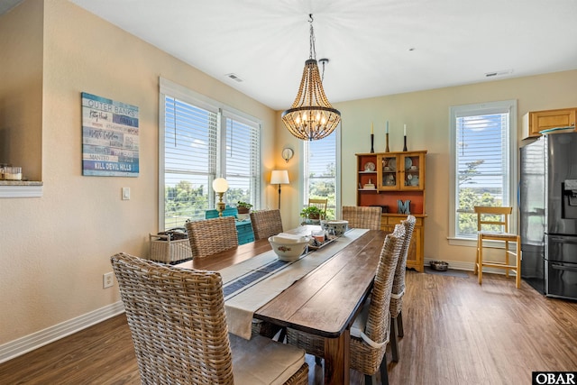 1800 Saint David Rd Unit 104-D 2, Kill Devil Hills, NC 27948 - dining area featuring dark wood-style flooring and a chandelier