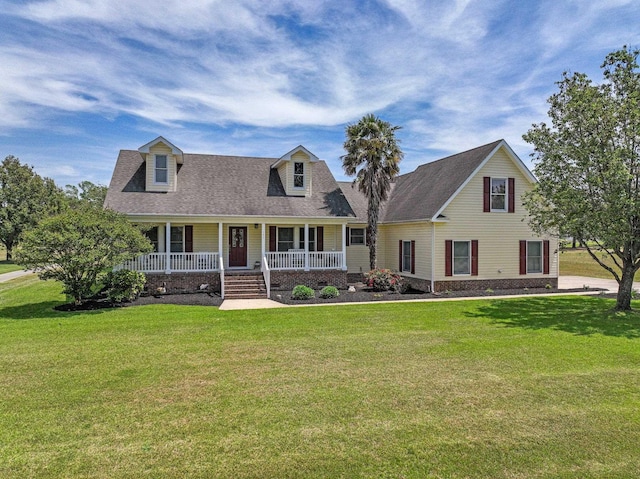 new england style home with a porch and a front lawn