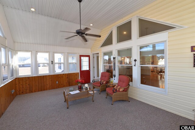 sunroom / solarium with lofted ceiling and ceiling fan