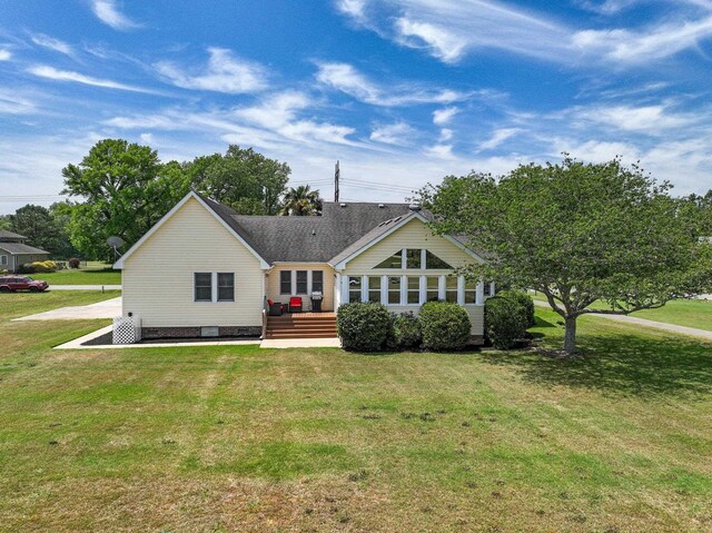 back of property featuring crawl space, a yard, and a wooden deck