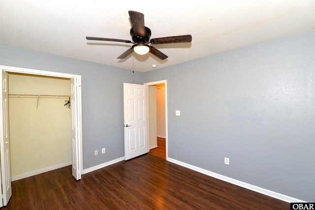 unfurnished bedroom with a ceiling fan, a closet, baseboards, and wood finished floors