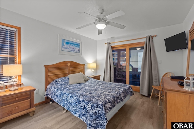 bedroom with access to exterior, baseboards, a ceiling fan, and wood finished floors