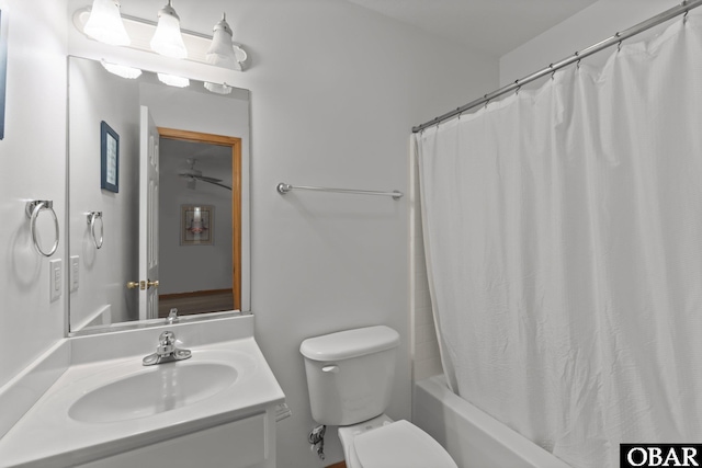 bathroom featuring shower / bath combo with shower curtain, vanity, and toilet