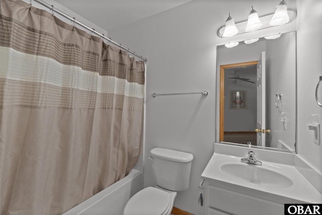 bathroom with shower / bath combination with curtain, vanity, and toilet