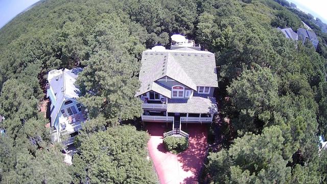 drone / aerial view with a view of trees