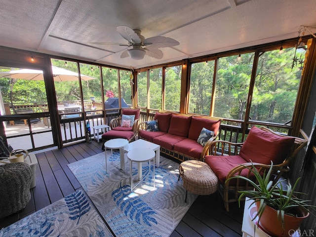 sunroom with a ceiling fan