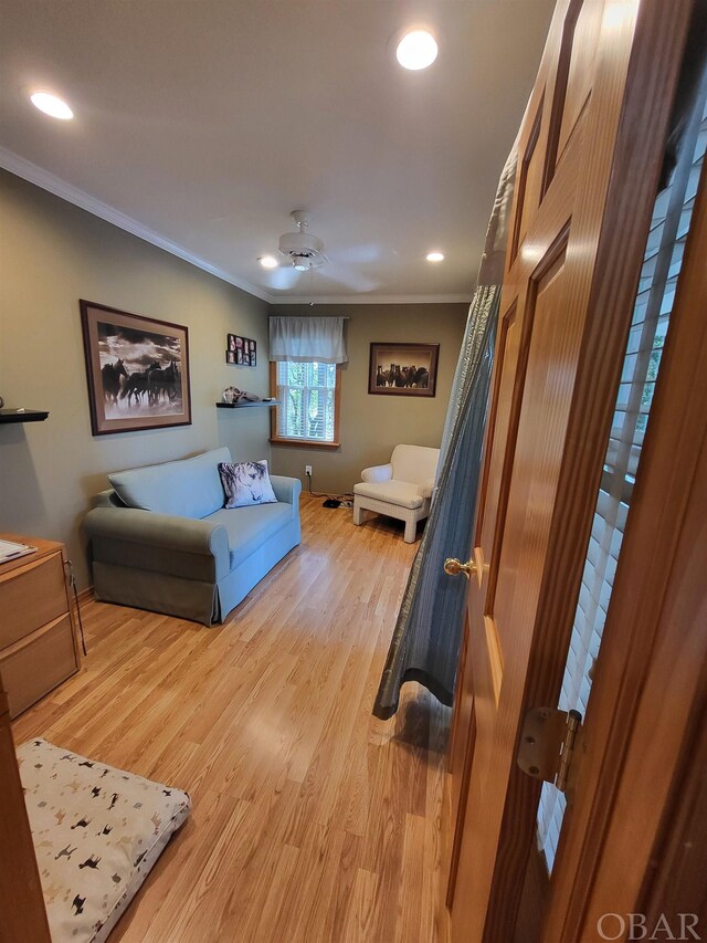 bedroom with recessed lighting, baseboards, crown molding, and wood finished floors