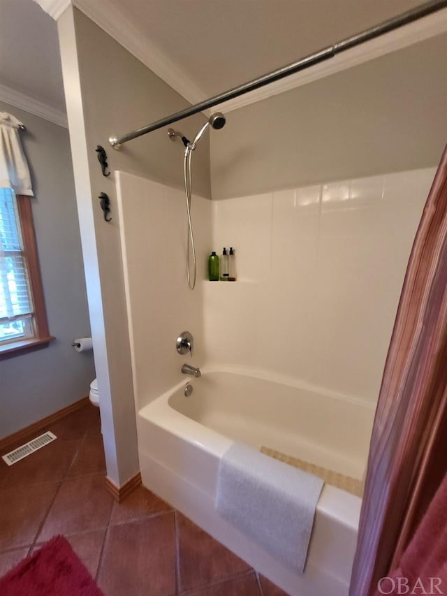 bathroom with toilet, visible vents, tile patterned floors, washtub / shower combination, and crown molding