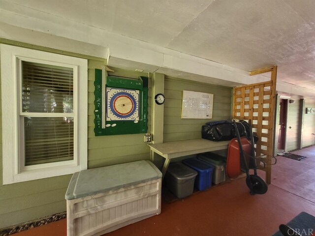 interior space featuring wooden walls