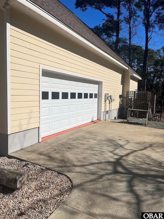 garage featuring driveway