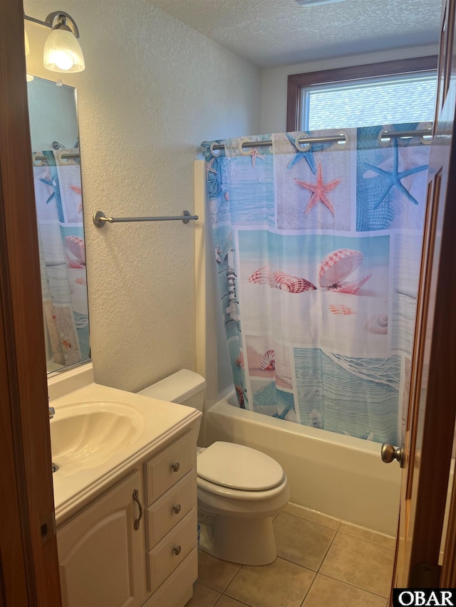 full bath featuring a textured wall, shower / tub combo, a textured ceiling, vanity, and tile patterned floors