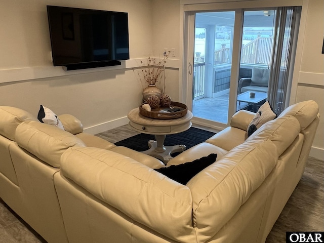 living room featuring baseboards and wood finished floors