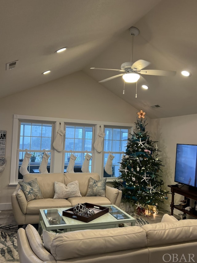 living room featuring visible vents, lofted ceiling, ceiling fan, wood finished floors, and recessed lighting