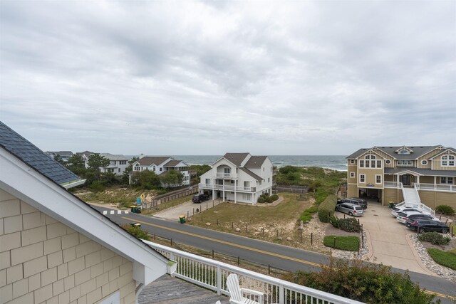 birds eye view of property featuring a water view and a residential view