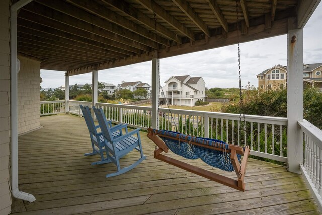 wooden deck with a residential view