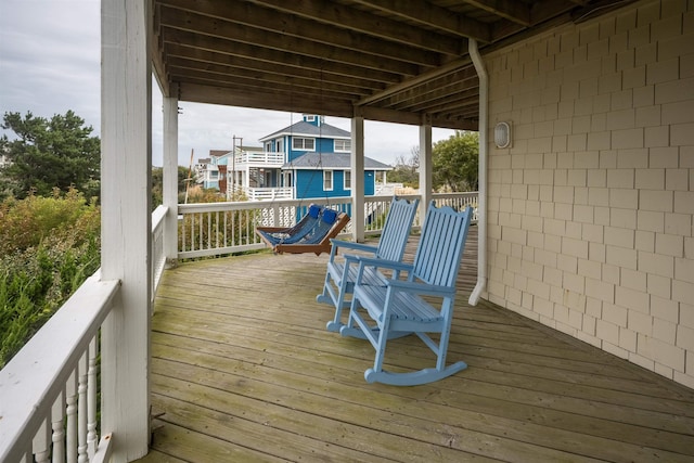 wooden terrace featuring a residential view