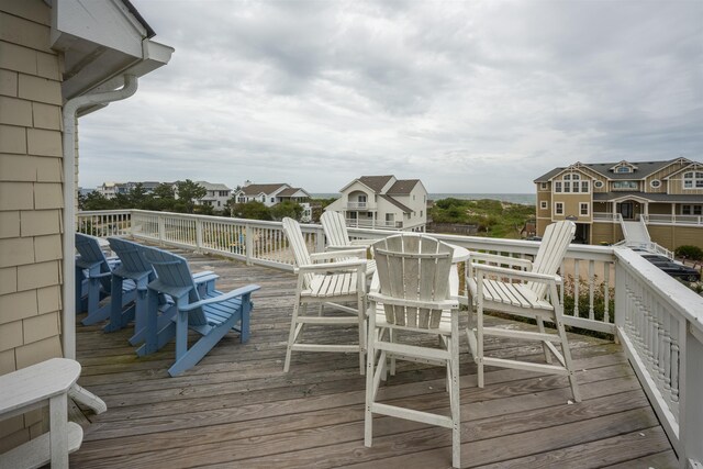 wooden terrace featuring a residential view