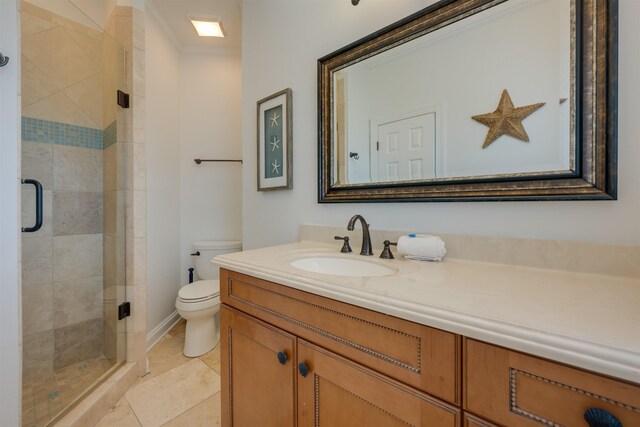 bathroom featuring toilet, tile patterned floors, a shower stall, and vanity