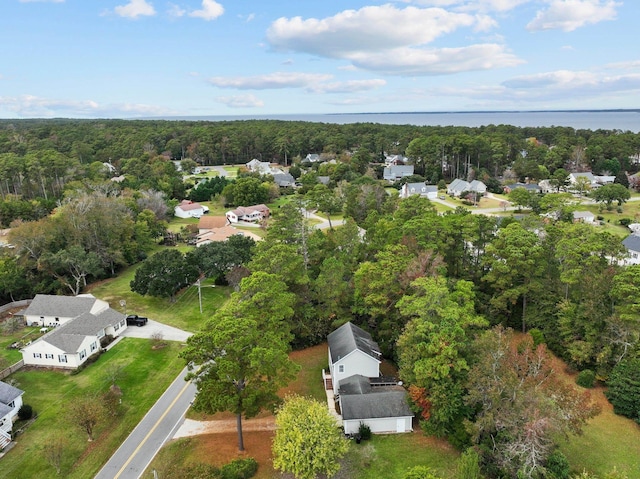 bird's eye view featuring a water view and a wooded view