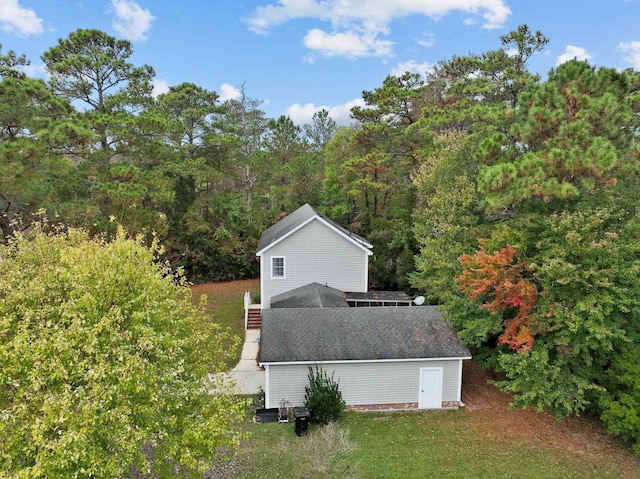 exterior space featuring a forest view