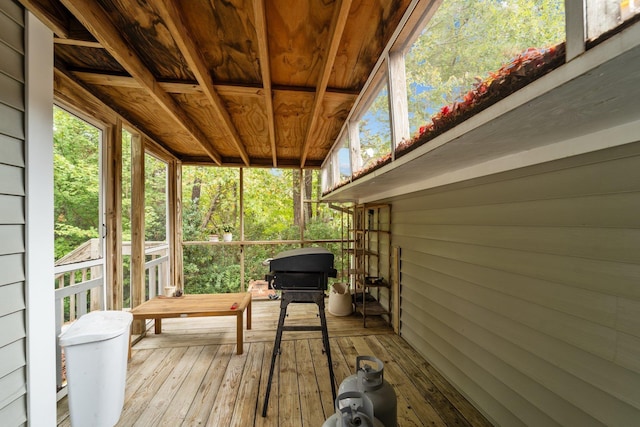 unfurnished sunroom with wooden ceiling