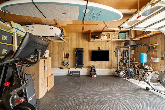 exercise room featuring wooden walls