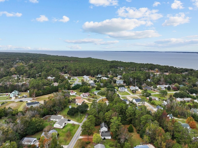 bird's eye view with a water view and a forest view