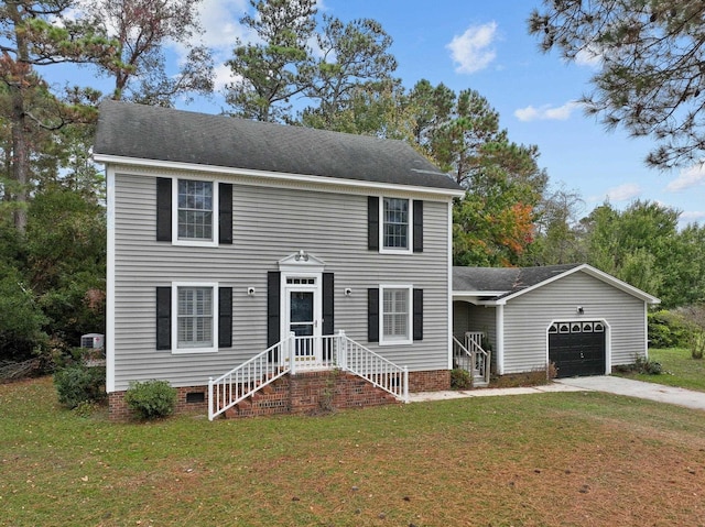 colonial-style house featuring an attached garage, concrete driveway, crawl space, roof with shingles, and a front lawn