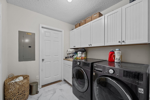 laundry area with marble finish floor, cabinet space, a textured ceiling, electric panel, and independent washer and dryer