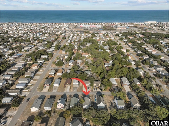 bird's eye view with a water view and a residential view