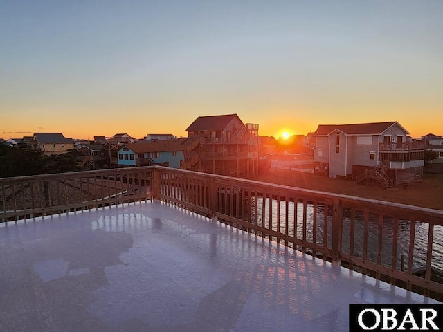 view of patio / terrace featuring a residential view, stairs, and a deck