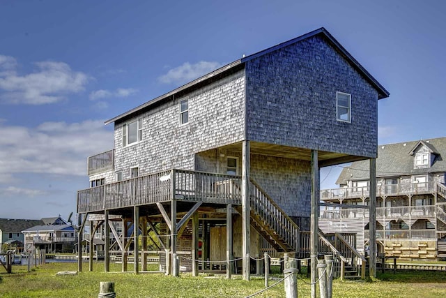 back of house with a deck and stairs