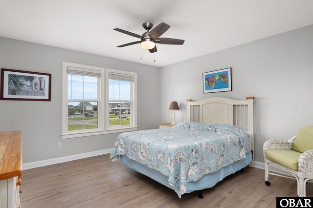 57241 Summerplace Dr Lot 28, Hatteras, NC 27943 - bedroom with light wood finished floors, baseboards, and a ceiling fan