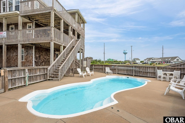 57241 Summerplace Dr Lot 28, Hatteras, NC 27943 - view of swimming pool featuring stairway, a patio area, and a deck