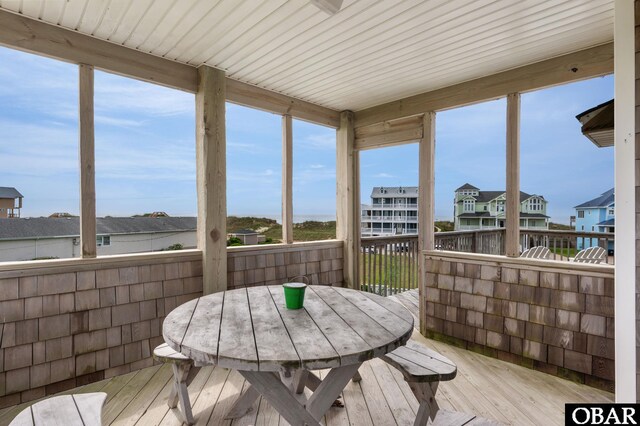 57241 Summerplace Dr Lot 28, Hatteras, NC 27943 - sunroom / solarium featuring a residential view and outdoor dining space