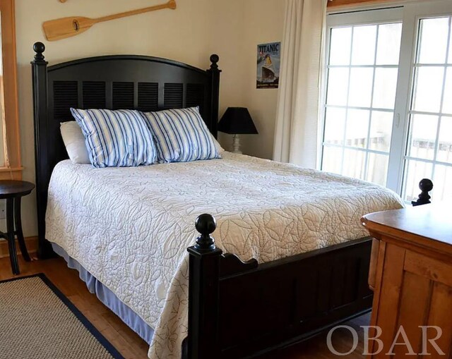 bedroom featuring dark wood-style floors