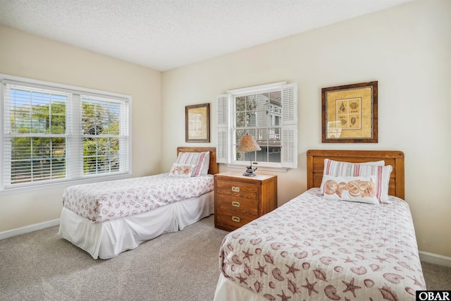 135 Ships Watch Dr Lot 32, Duck, NC 27949 - carpeted bedroom with baseboards and a textured ceiling