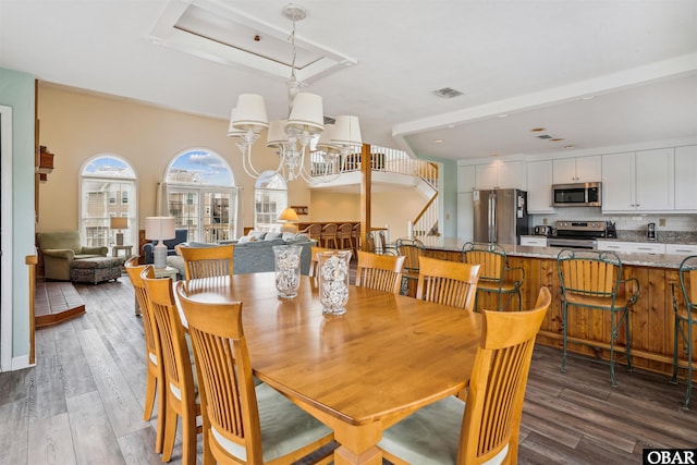 135 Ships Watch Dr Lot 32, Duck, NC 27949 - dining space with wood finished floors, a chandelier, and stairway