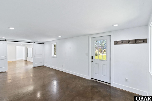 113 B And B Ln, Coinjock, NC 27923 - empty room featuring a barn door, recessed lighting, and finished concrete flooring
