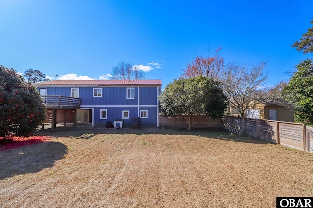 113 B And B Ln, Coinjock, NC 27923 - back of property with a fenced backyard and board and batten siding