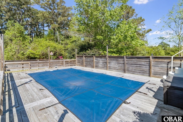 113 B And B Ln, Coinjock, NC 27923 - view of swimming pool with a wooden deck, a fenced backyard, and view of wooded area