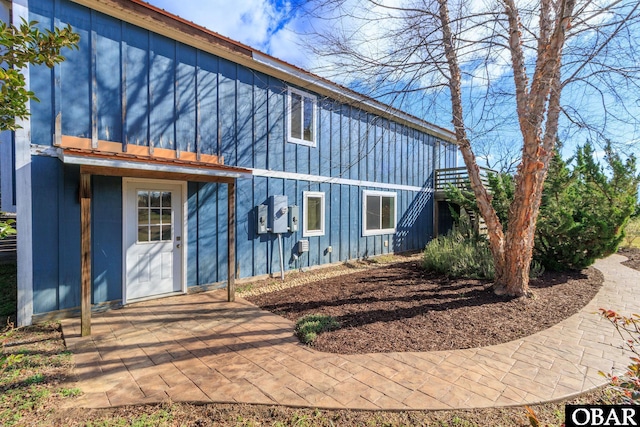 113 B And B Ln, Coinjock, NC 27923 - back of property featuring board and batten siding and a patio