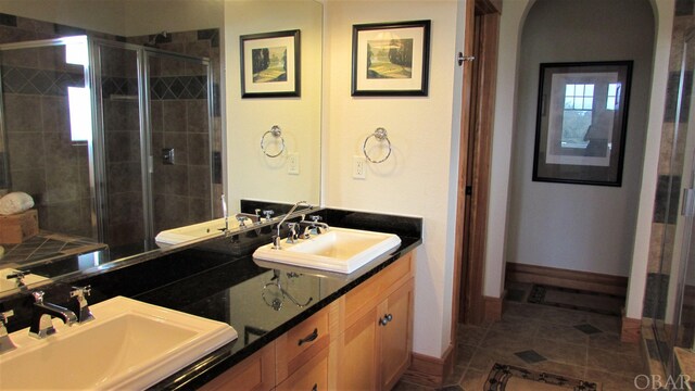 744 Hammock Ln Lot 342, Corolla, NC 27927 - full bathroom with double vanity, a stall shower, and a sink