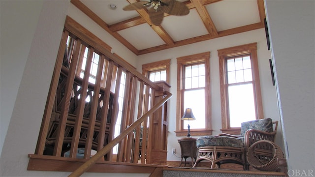 interior space featuring a high ceiling and beamed ceiling